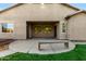 Covered backyard patio with concrete flooring, wooden bench, and view of the grassy yard offers a relaxing retreat at 4326 E Cloudburst Ct, Gilbert, AZ 85297