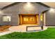 A covered backyard patio with lush green grass and outdoor seating perfect for entertaining at 4326 E Cloudburst Ct, Gilbert, AZ 85297