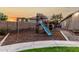 Backyard view showcases a charming playset with swings and slide, perfect for Gathering fun and outdoor adventures at 4326 E Cloudburst Ct, Gilbert, AZ 85297