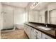 Bright bathroom features a soaking tub, walk-in shower, and double sink vanity at 4326 E Cloudburst Ct, Gilbert, AZ 85297