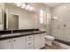 Modern bathroom features dual sinks and a glass-enclosed shower with a rainfall shower head at 4326 E Cloudburst Ct, Gilbert, AZ 85297