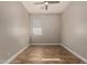 Bedroom features wood-look flooring, neutral paint and a window with blinds at 4326 E Cloudburst Ct, Gilbert, AZ 85297