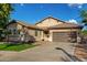 Lovely single-story house with a well-kept lawn, desert landscaping, and a two-car garage at 4326 E Cloudburst Ct, Gilbert, AZ 85297