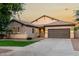 Charming single-story home featuring a neutral color palette, tile roof, and a well-manicured front lawn at 4326 E Cloudburst Ct, Gilbert, AZ 85297