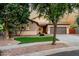 Well-maintained home boasts a tile roof, desert landscaping, and a two-car garage at 4326 E Cloudburst Ct, Gilbert, AZ 85297