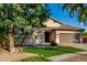 Inviting single-story home with a lush green lawn and a convenient two-car garage at 4326 E Cloudburst Ct, Gilbert, AZ 85297