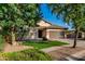 Charming single-story home featuring a well-manicured front yard and a two-car garage at 4326 E Cloudburst Ct, Gilbert, AZ 85297