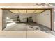 Spacious garage with ample storage shelves and an open layout is perfect for vehicles and projects at 4326 E Cloudburst Ct, Gilbert, AZ 85297