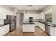 Beautiful kitchen with white cabinetry, stainless steel appliances, and center island at 4326 E Cloudburst Ct, Gilbert, AZ 85297
