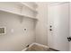 Functional laundry room with ample shelving for storage and easy access to laundry hookups at 4326 E Cloudburst Ct, Gilbert, AZ 85297