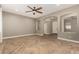 Open-concept living area with herringbone flooring, arched doorways and neutral color palette at 4326 E Cloudburst Ct, Gilbert, AZ 85297