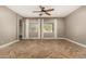 Spacious living room boasts stylish herringbone wood floors, neutral walls, and modern ceiling fan at 4326 E Cloudburst Ct, Gilbert, AZ 85297