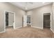 Spacious main bedroom with a ceiling fan and access to the bathroom, shower, and walk-in closet at 4326 E Cloudburst Ct, Gilbert, AZ 85297