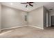 Spacious main bedroom featuring neutral paint, ceiling fan and carpet flooring at 4326 E Cloudburst Ct, Gilbert, AZ 85297