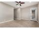 Large main bedroom features carpet flooring, neutral paint, a ceiling fan, recessed lighting and outdoor access at 4326 E Cloudburst Ct, Gilbert, AZ 85297