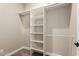 A view of the walk-in closet with multiple shelves and hanging rods at 4326 E Cloudburst Ct, Gilbert, AZ 85297