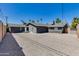 Home features a low maintenance backyard, gravel, privacy wall, and palm trees at 4435 N 35Th St, Phoenix, AZ 85018
