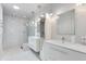 Bright bathroom featuring dual vanities, glass-enclosed shower, contemporary fixtures, and recessed lighting at 4435 N 35Th St, Phoenix, AZ 85018