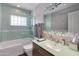 Bathroom with shower-tub combo, neutral paint, with modern vanity and sink at 4435 N 35Th St, Phoenix, AZ 85018