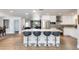 Bright, modern kitchen featuring a large island with seating, stainless steel appliances, and sleek white cabinetry at 4435 N 35Th St, Phoenix, AZ 85018