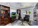 Spacious office with bookshelves, computer desk, office chair, and lots of natural light at 4435 N 35Th St, Phoenix, AZ 85018