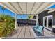 Under a pergola, patio seating overlooks a low maintenance yard with blue sky at 4435 N 35Th St, Phoenix, AZ 85018
