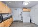 Storage room with white cabinets, countertops, and neutral paint and flooring at 4435 N 35Th St, Phoenix, AZ 85018