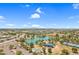 An aerial shot displaying a lake with recreational areas, a playground, and lush landscaping in a vibrant community at 4615 W Del Rio St, Chandler, AZ 85226