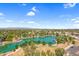 Attractive aerial view featuring a scenic lake surrounded by parks and the residential neighborhood at 4615 W Del Rio St, Chandler, AZ 85226