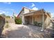 Desert landscaping in backyard with covered patio, barbecue, table and chairs at 4615 W Del Rio St, Chandler, AZ 85226
