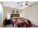 Comfortable bedroom featuring a ceiling fan, soft lighting and decor at 4615 W Del Rio St, Chandler, AZ 85226