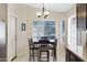 Bright dining area with a table set for six, and a large window with natural light at 4615 W Del Rio St, Chandler, AZ 85226