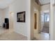 Spacious hallway featuring tile flooring, neutral paint, and arched doorways to living spaces at 4615 W Del Rio St, Chandler, AZ 85226