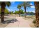 Park featuring walking path, mature palm trees, and tennis courts at 4615 W Del Rio St, Chandler, AZ 85226