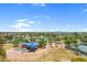 Overhead view of a playground and green space within the community, framed by a serene lake and mature trees at 4615 W Del Rio St, Chandler, AZ 85226
