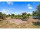 Community park featuring a volleyball court and shaded picnic area, nestled among mature trees and green lawns at 4615 W Del Rio St, Chandler, AZ 85226