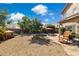 Expansive backyard featuring a refreshing pool, gravel landscaping, and inviting patio space at 4626 E Summerhaven Dr, Phoenix, AZ 85044