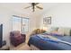 Inviting bedroom features natural light, neutral tones, and a ceiling fan, making it very pleasant at 4626 E Summerhaven Dr, Phoenix, AZ 85044