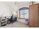 Functional room can be utilized as a bedroom or office, highlighting the natural light and ceiling fan at 4626 E Summerhaven Dr, Phoenix, AZ 85044