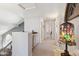 Bright hallway with carpet flooring leads to other rooms, showcasing the home's layout at 4626 E Summerhaven Dr, Phoenix, AZ 85044