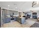 Open-concept kitchen with stainless steel appliances, center island, granite counters, and seamless flow into the living area at 4626 E Summerhaven Dr, Phoenix, AZ 85044