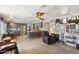 Spacious living area featuring kitchen, ceiling fan, and unique decor, creating a stylish and comfortable atmosphere at 4626 E Summerhaven Dr, Phoenix, AZ 85044