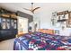 Comfortable primary bedroom features a decorative bedspread, high ceilings, and ample storage at 4626 E Summerhaven Dr, Phoenix, AZ 85044