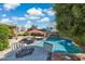 Inviting backyard showcasing a sparkling pool, lounge chairs, and shaded patio area at 4626 E Summerhaven Dr, Phoenix, AZ 85044