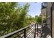 Private balcony with greenery, offering a peaceful outdoor retreat with nearby trees at 475 N 9Th St # 206, Phoenix, AZ 85006