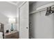 Well-organized closet with shelving, clothing rods, and modern sliding door, next to a bedside table at 475 N 9Th St # 206, Phoenix, AZ 85006