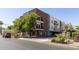 Modern brick and stucco condo building with covered parking and stylish landscaping at 475 N 9Th St # 206, Phoenix, AZ 85006