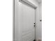 Elegant unit door in white with black hardware and unit number signage at 475 N 9Th St # 206, Phoenix, AZ 85006