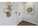 Hallway with modern decor, including unique wall mirrors and tasteful artwork at 475 N 9Th St # 206, Phoenix, AZ 85006