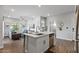 Kitchen island with seating overlooking the living room with lots of natural light at 475 N 9Th St # 206, Phoenix, AZ 85006